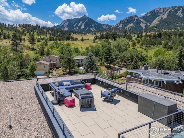 view of patio with a mountain view and outdoor lounge area