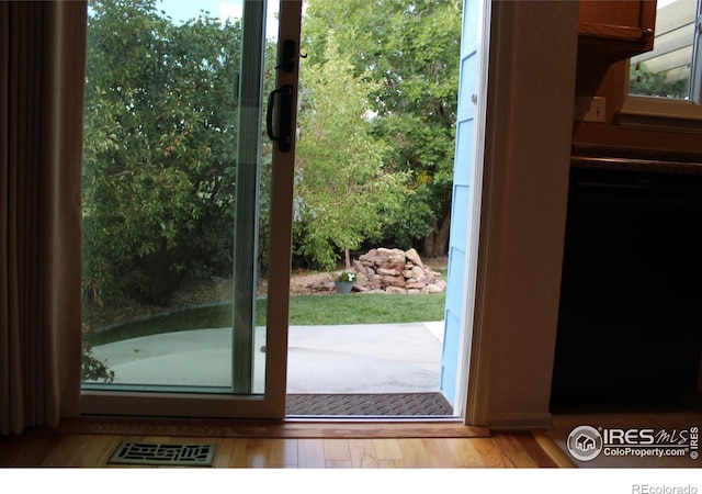 doorway featuring hardwood / wood-style flooring