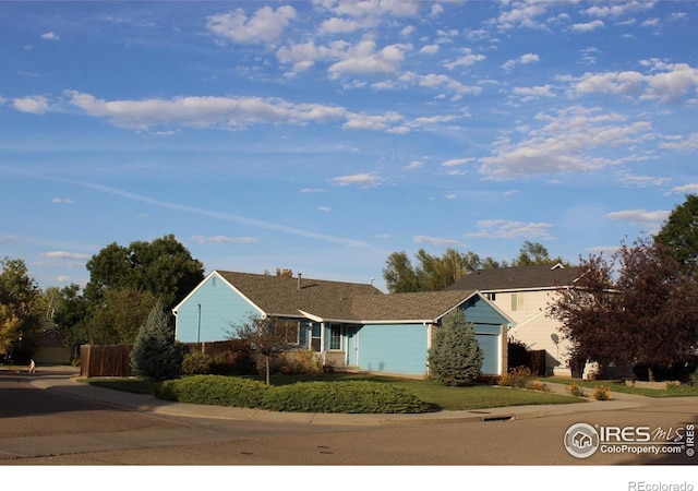 single story home featuring a garage