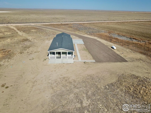 birds eye view of property featuring a rural view