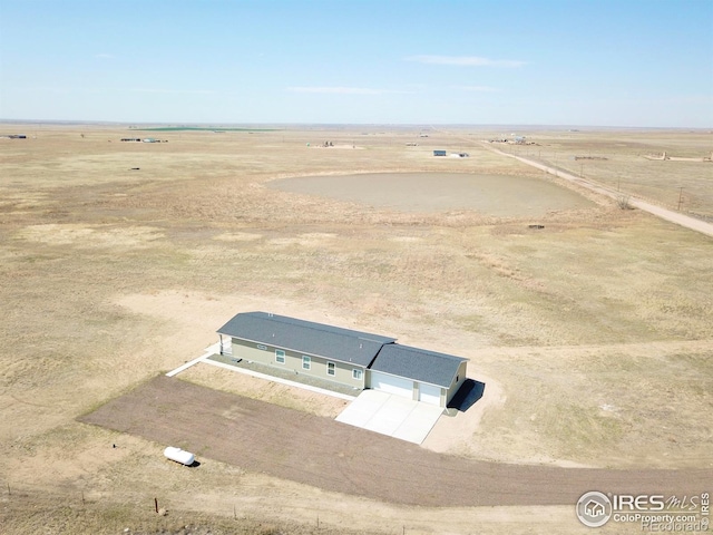 birds eye view of property featuring a rural view