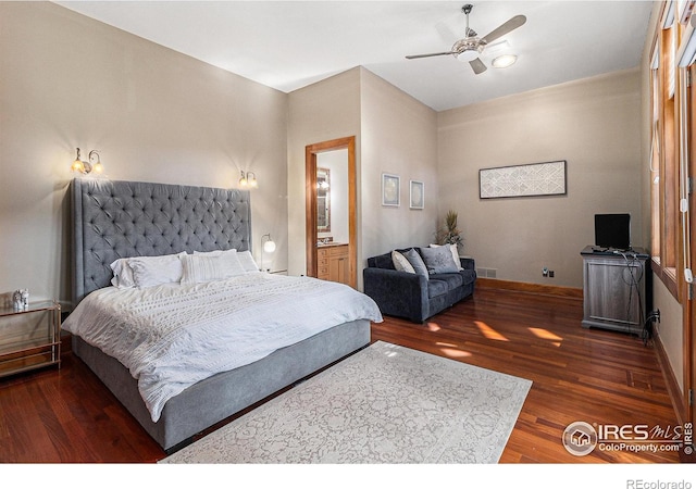 bedroom with ceiling fan, ensuite bathroom, and dark hardwood / wood-style flooring