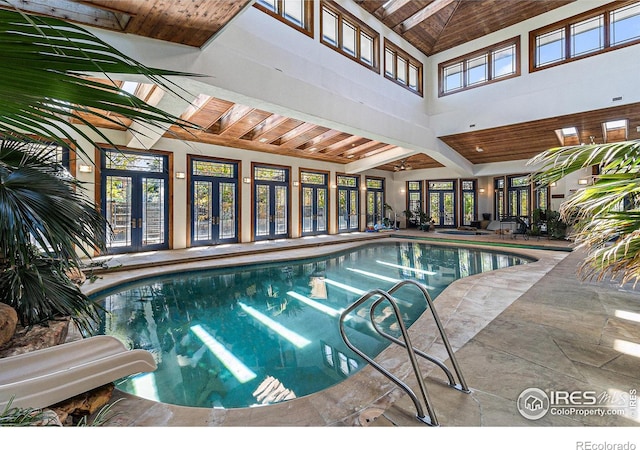 view of swimming pool featuring a skylight