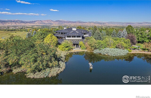 8532 Strawberry Ln, Niwot, CO 80503 - drone / aerial view with a water and mountain view