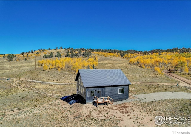 birds eye view of property with a rural view