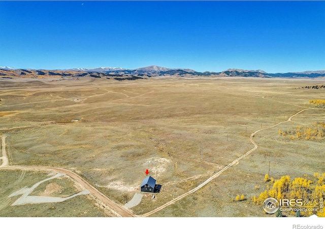 drone / aerial view featuring a mountain view