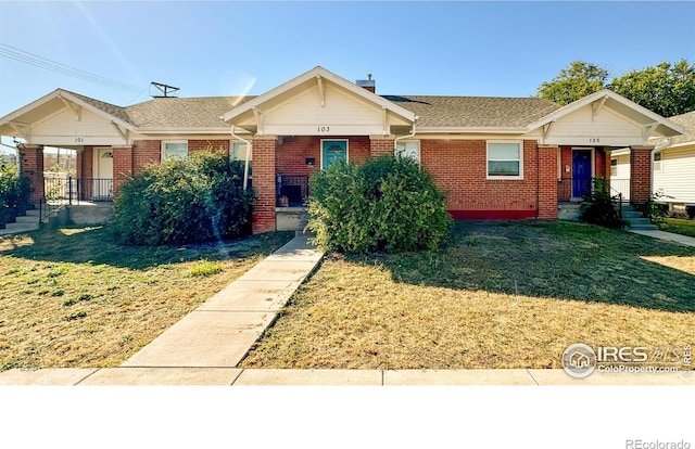 101-105 Factory St, Sterling, CO 80751 - single story home featuring brick siding and a front lawn