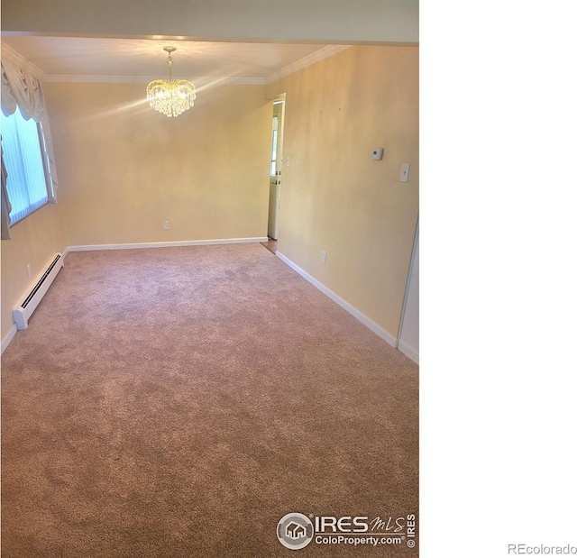 empty room featuring an inviting chandelier, ornamental molding, baseboard heating, and carpet floors