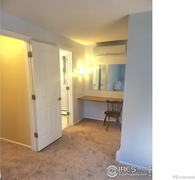 corridor with light colored carpet, baseboard heating, and a wall unit AC