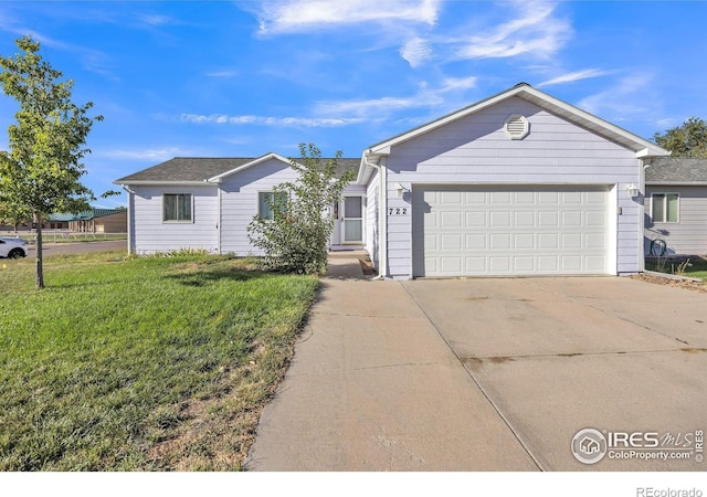 ranch-style home with a front yard and a garage