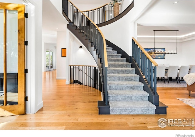 stairway with wood-type flooring