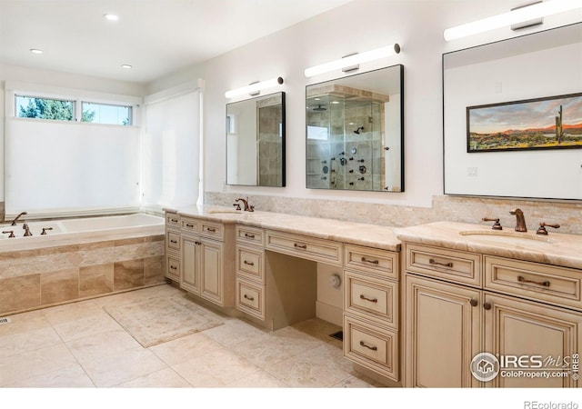 bathroom with vanity, shower with separate bathtub, and tile patterned floors