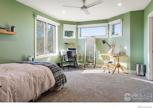 carpeted bedroom with ceiling fan