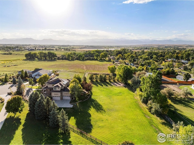 drone / aerial view featuring a mountain view and a rural view