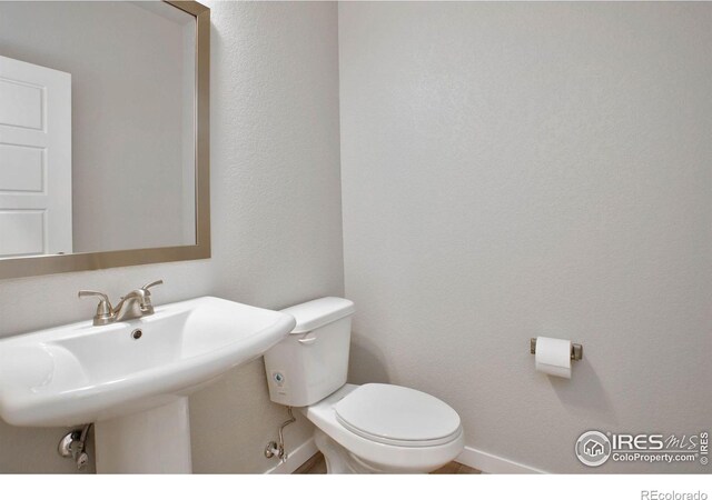 bathroom featuring toilet