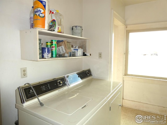 washroom with washing machine and dryer