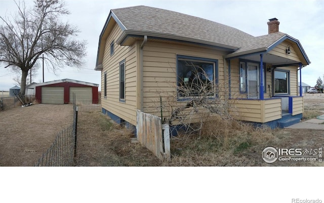 view of front of house featuring an outbuilding and a garage