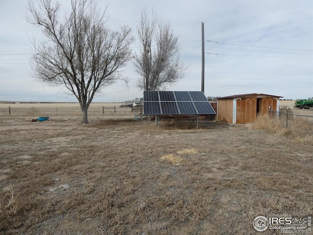 view of yard with a rural view