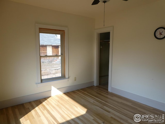 spare room featuring ceiling fan and wood-type flooring