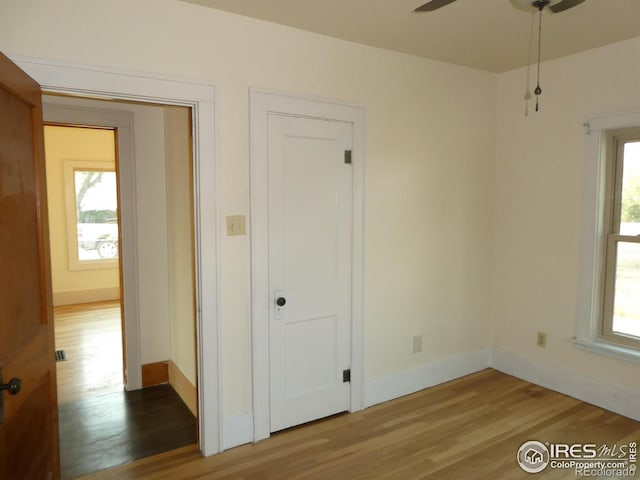 spare room featuring hardwood / wood-style flooring and ceiling fan