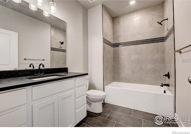 265 High Point Dr Unit 203, Longmont, CO 80504 - full bathroom featuring vanity, shower / washtub combination, toilet, tile patterned floors, and recessed lighting