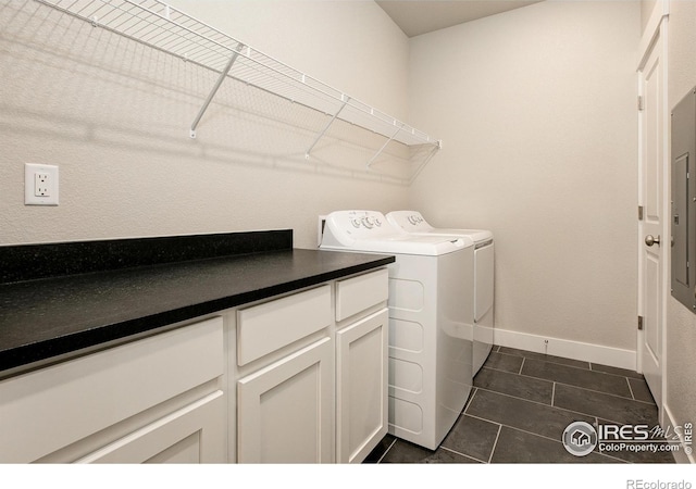 265 High Point Dr Unit 203, Longmont, CO 80504 - laundry area with separate washer and dryer, dark tile patterned flooring, and baseboards