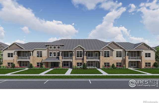 265 High Point Dr Unit 203, Longmont, CO 80504 - view of front of house featuring stone siding, a balcony, and a front lawn