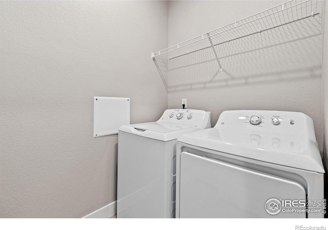 laundry area with independent washer and dryer