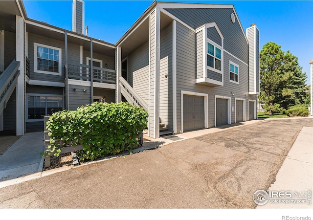 view of side of home featuring a garage