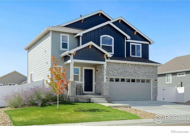 view of front facade with a garage and a front yard