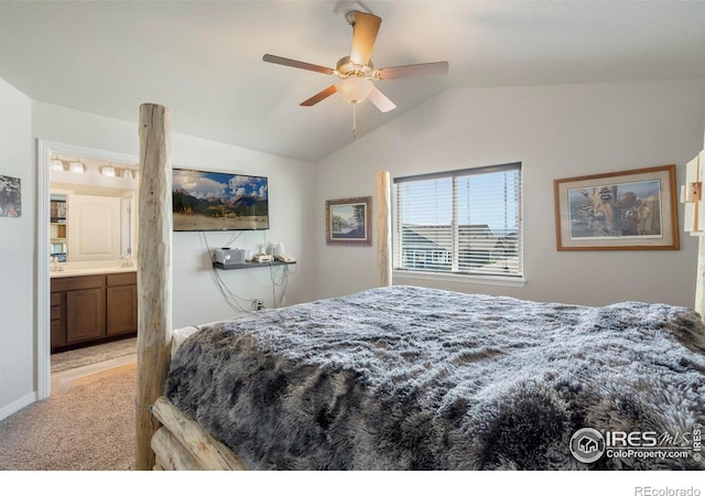 carpeted bedroom featuring connected bathroom, lofted ceiling, and ceiling fan