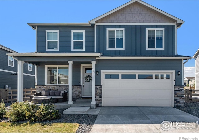 craftsman house with a garage and covered porch