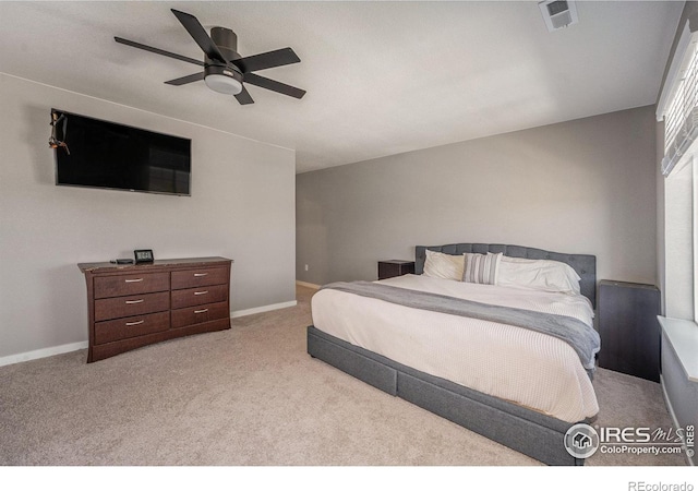 bedroom featuring ceiling fan and light colored carpet