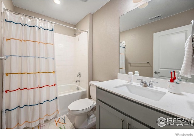 full bathroom featuring shower / tub combo, vanity, and toilet