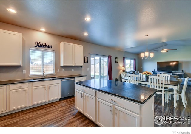 kitchen featuring white cabinets, sink, a healthy amount of sunlight, and stainless steel dishwasher