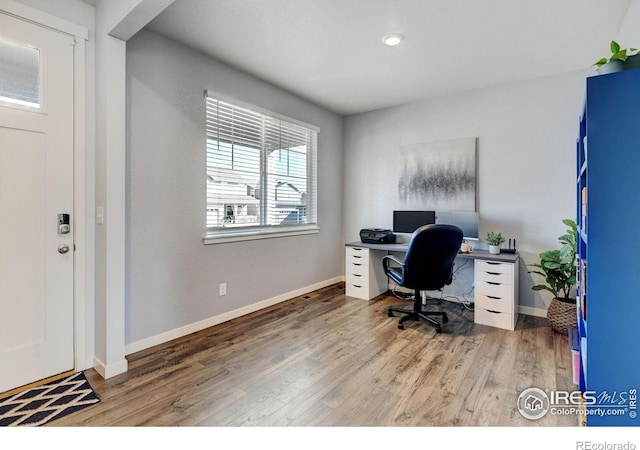 office area with wood-type flooring