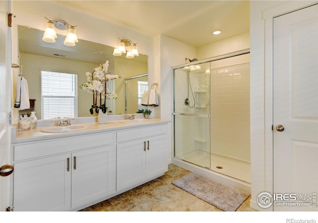 bathroom with vanity and an enclosed shower