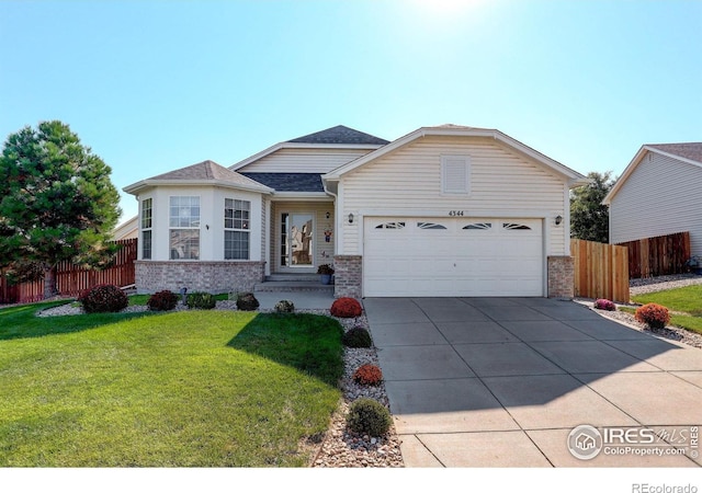 single story home with a front yard and a garage