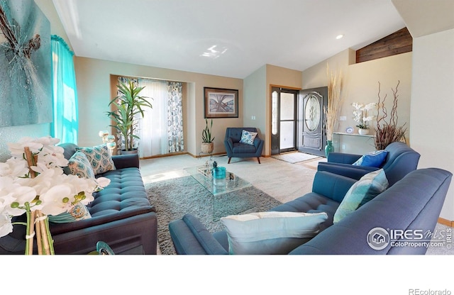 living room with light carpet, lofted ceiling, and a healthy amount of sunlight