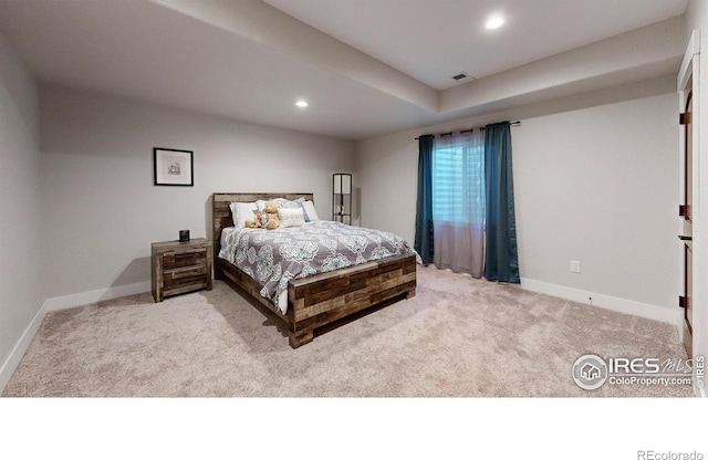 bedroom featuring light colored carpet