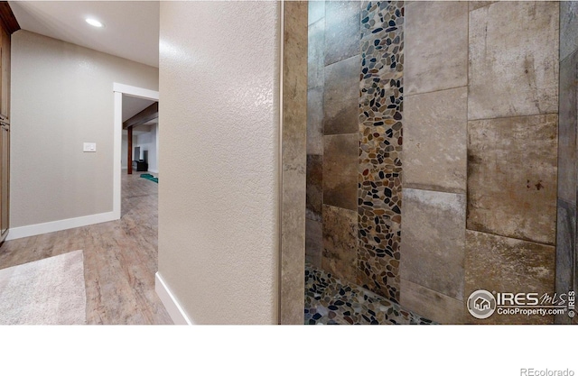 bathroom with wood-type flooring