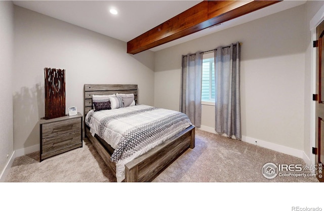 bedroom featuring beam ceiling and light colored carpet