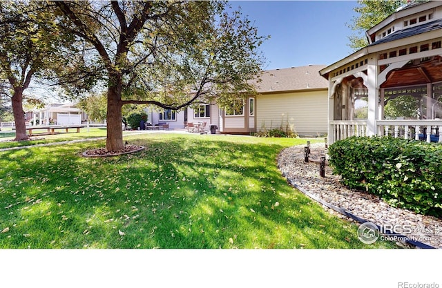 view of yard with a sunroom