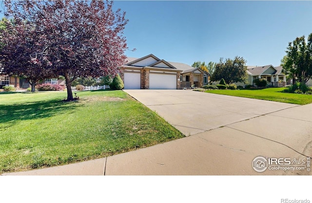 view of front facade with a garage and a front lawn