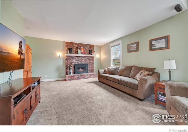 living room with light colored carpet and a fireplace