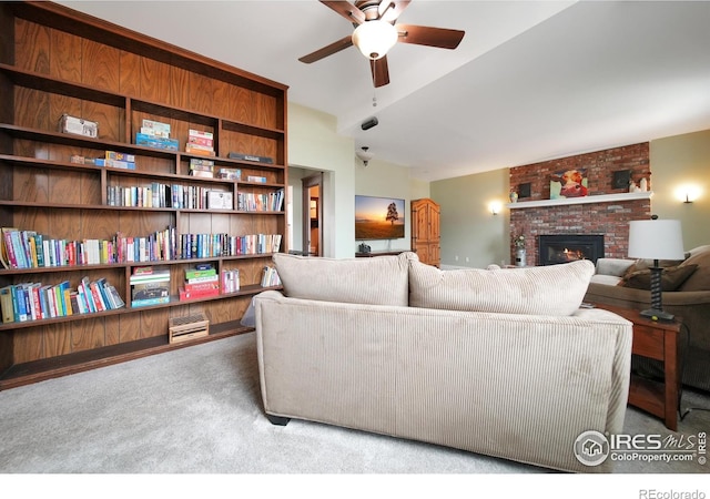 carpeted living room with a fireplace