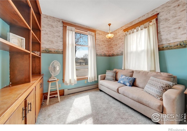 carpeted living room with a baseboard radiator