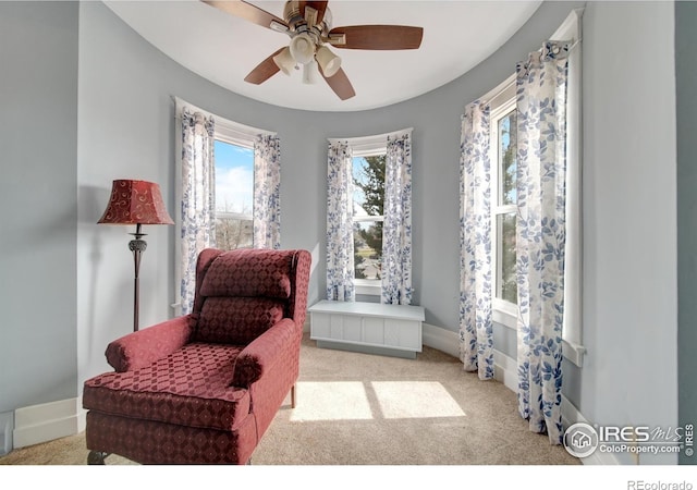 sitting room with light carpet and ceiling fan