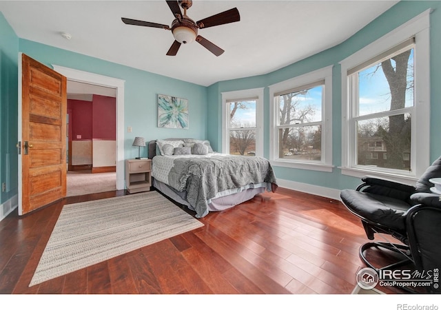 bedroom with ceiling fan and dark hardwood / wood-style flooring