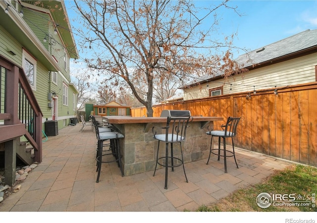 view of patio / terrace with a bar